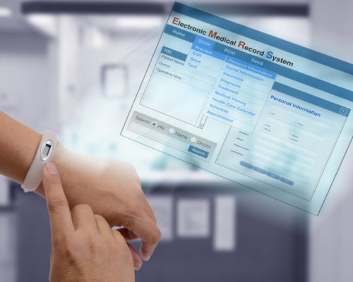 Using IT technology on hand to show patient information and medical record on screen.